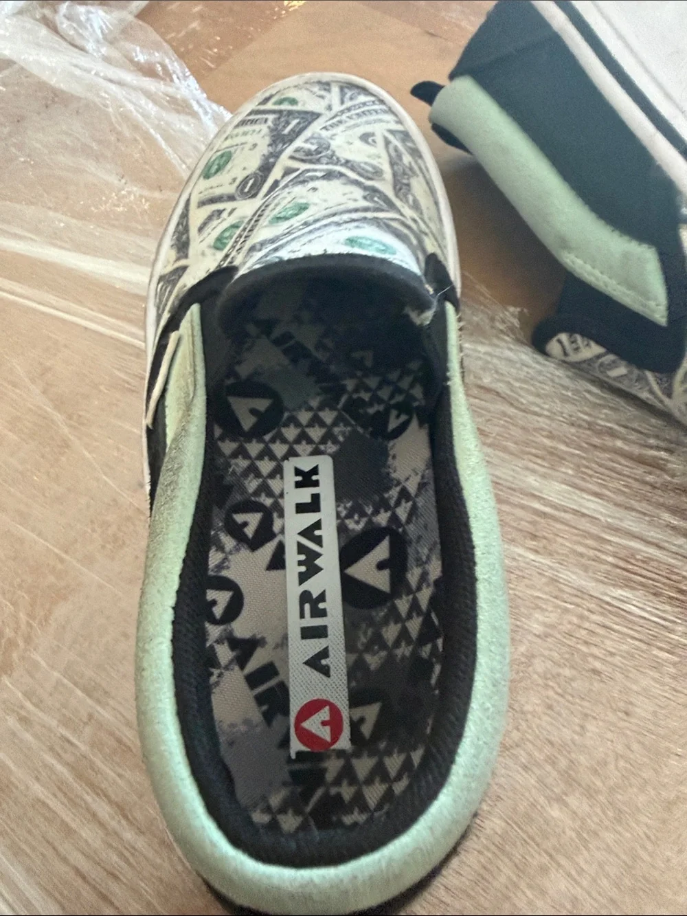 Airwalk Kids Slip-On Sneakers in White, Black & Green Dollar Print